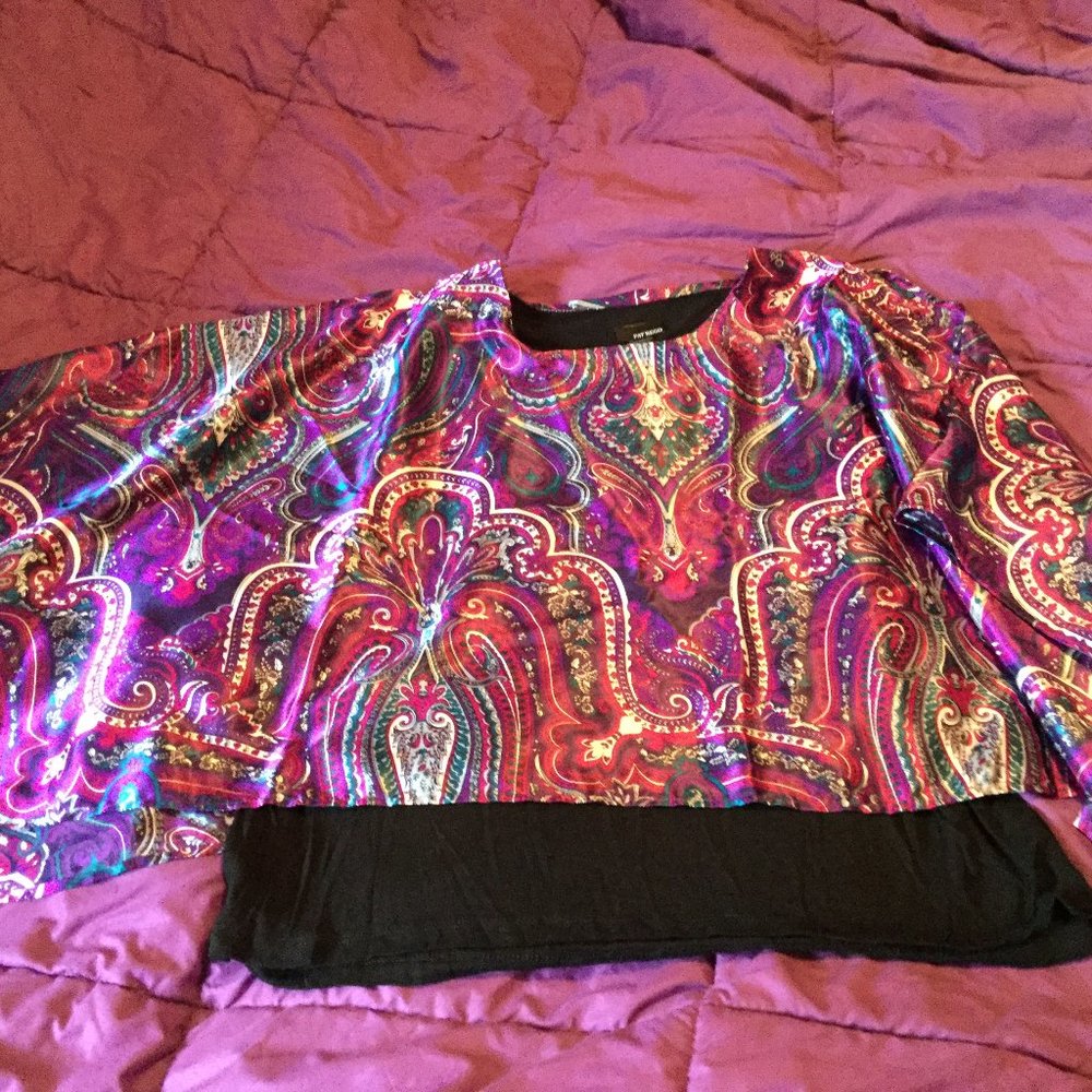 Pat Rego purple cape top with black tank top.